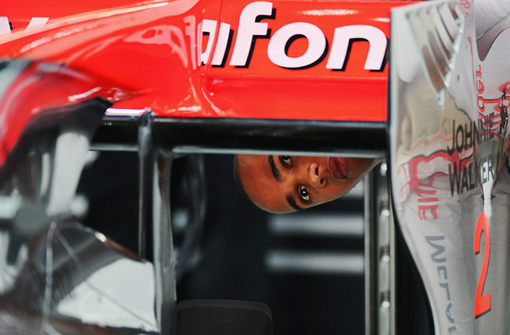 Korean Grand Prix: Lewis Hamilton checks out the rear wing of his McLaren Mercedes 