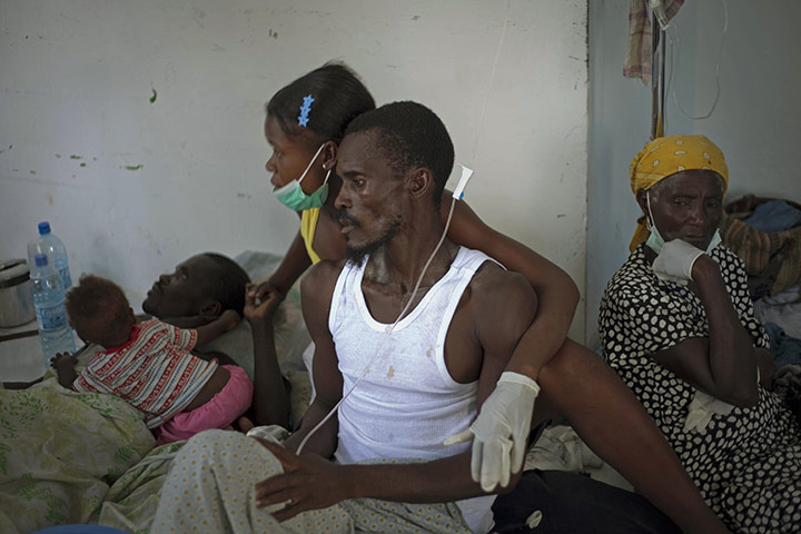 24 Hours in Pictures: Haitian patients with cholera receive medical attention at a hospital