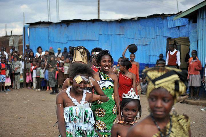 24 hours: Nairobi, Kenya: Residents of the Korogocho slum wait to get on the catwalk