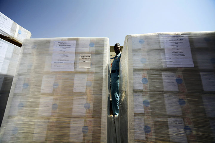 24 hours: Khartoum, Sudan: A policeman stands guard at the airport