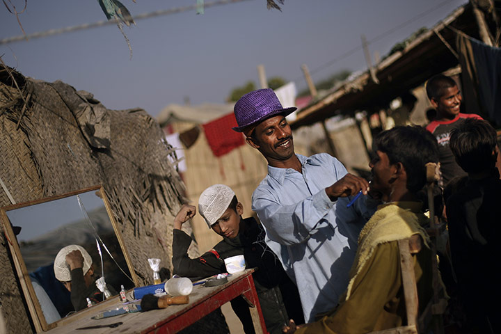 24 hours in pictures: a street barber in Rawalpindi, Pakistan