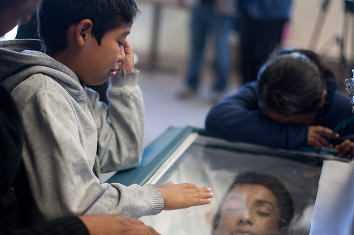 24 hours in pictures: Funeral of 13 youngsters killed in Ciudad Juarez