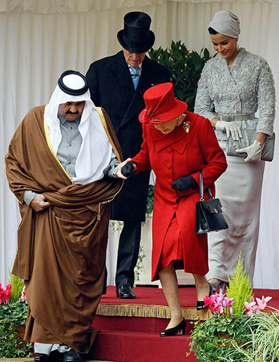 Emir of Qatar state visit: Queen Elizabeth II  takes the hand of Qatar's emir