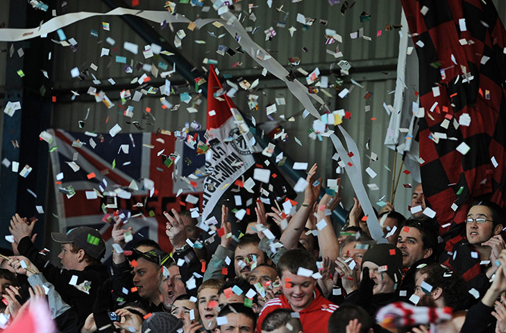 FC United: FC United fans greet their team with ticker tape, paper rolls 
