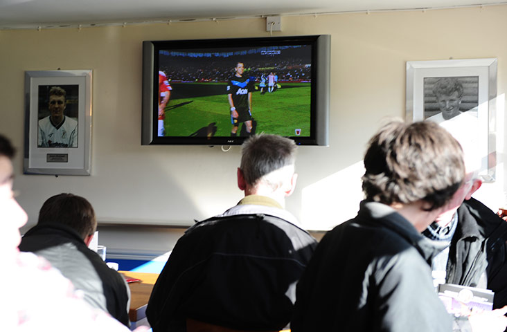 FC United: FC United fans watch the Stoke v Manchester Utd Premier League match
