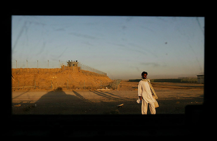 From the agencies: A man stands on the side of a highway 