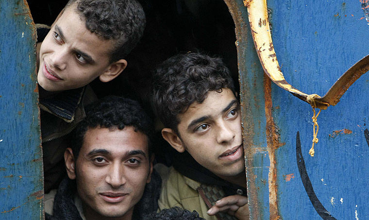 24 hours in pictures: Would-be immigrants in Sicily