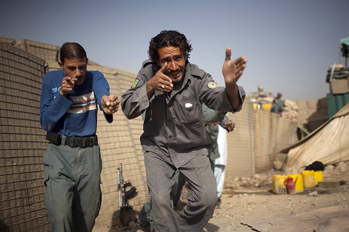 24 hours in pictures: afghan police train with  US  Military Police