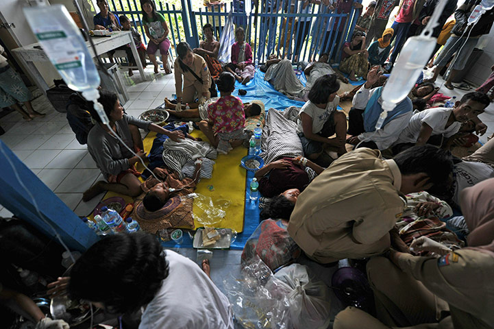 Indonesia Update: Medical workers take care of wounded vic