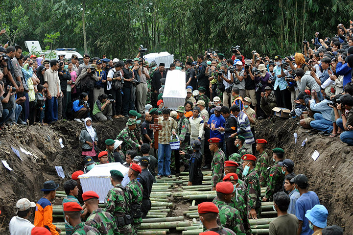 Indonesia Update: Residents, Indonesian soldiers and police hold a mass funeral in Sleman