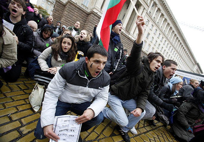 24 Hours In Pictures: Bulgarian students shout slogans during a demo in Sofia