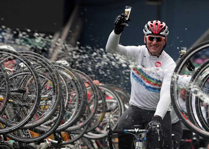 2003 RWC winners: Lawrence Dallaglio celebrates as he finishes his charity cycle ride