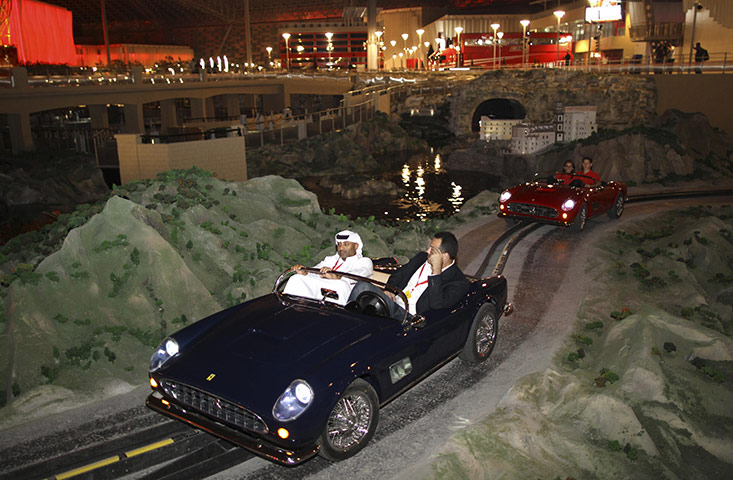 Ferrari World: Visitors ride in miniature Ferrari cars at Ferrari World in Abu Dhabi