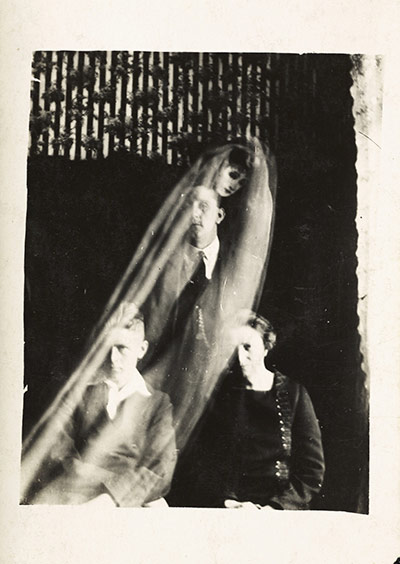 William Hope ghost pics: Woman with two boys and a female spirit, c 1920.