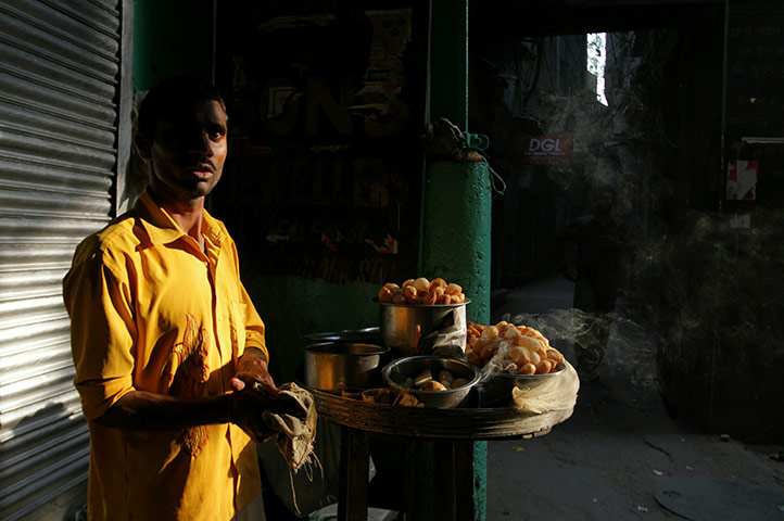 24 hours in pictures: A street vendor in Chandni Chowk market in the streets of Old Delhi