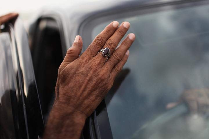 Pakistan floods- Punjab: A desperate flood affectee leans against the jeep of Jamshed Dasti