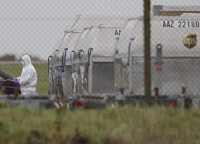 Cargo Terror: An officer removes a package from a UPS container at East Midlands Airport