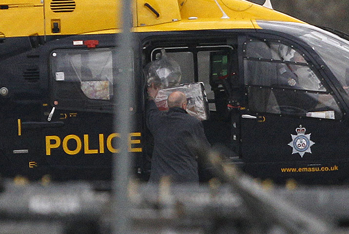 Cargo Terror: A package is loaded onto a police helicopter at East Midlands Airport