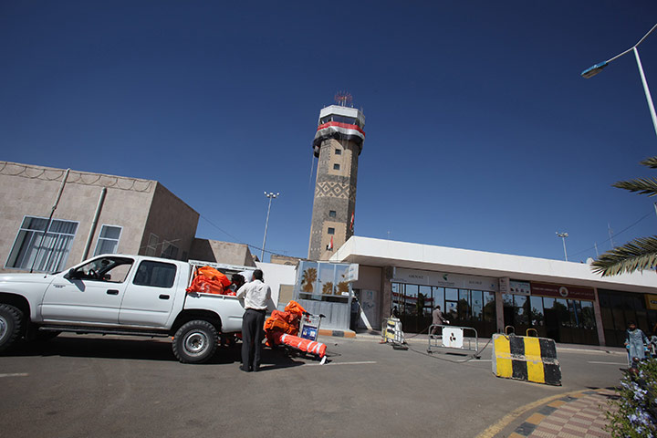 Cargo Terror: Workers load packages onto a truck at Sanaa International Airport