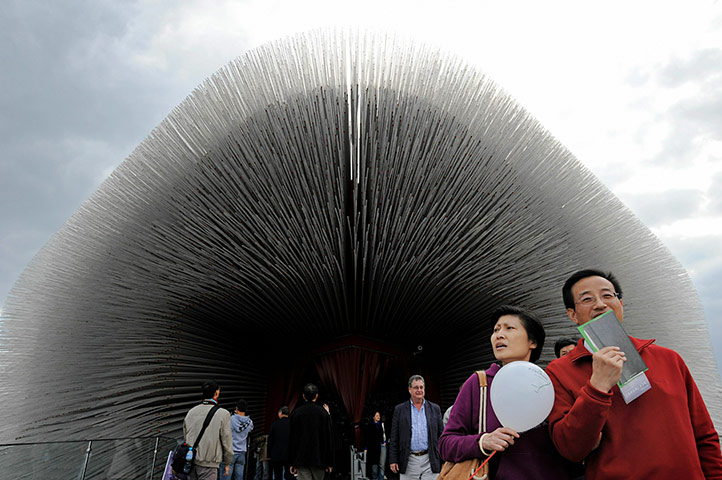 24 hours in pictures: Visitors walk out of the UK pavilion at
