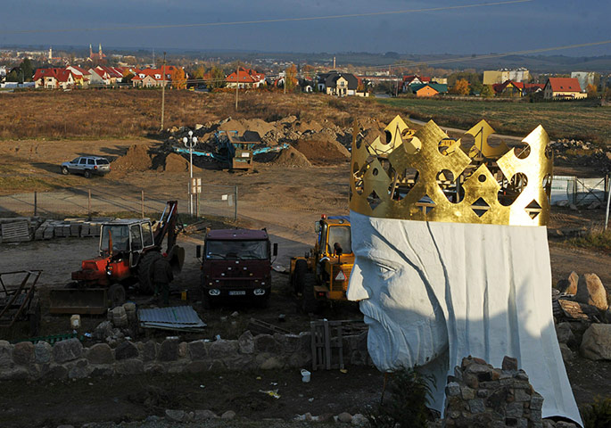 24 hours in pictures: TOPSHOTS The head of the Christ statue t