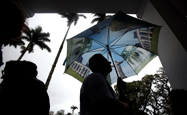 Brazil elections: People wait outside a polling station prior