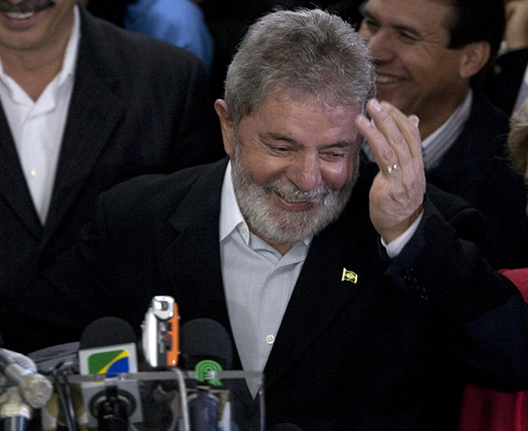 Brazil elections: President Luiz Inacio Lula da Silva gestures as he attends a conference
