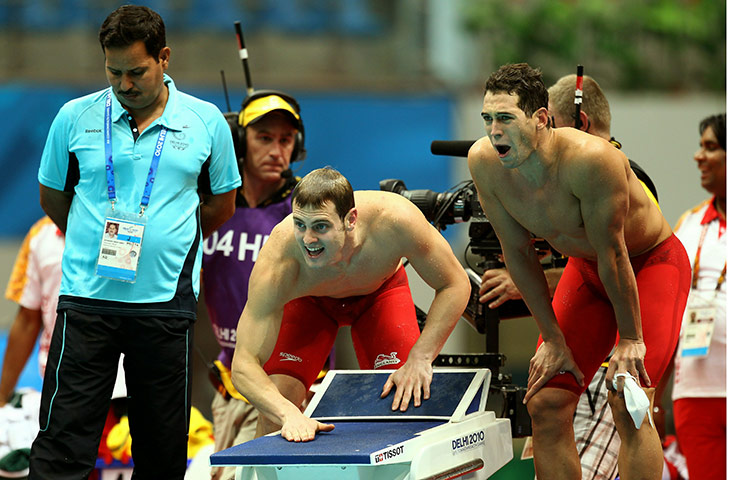 Commonwealth Games: Liam Tancock and Simon Burnett of England cheer on team mate, Swimming