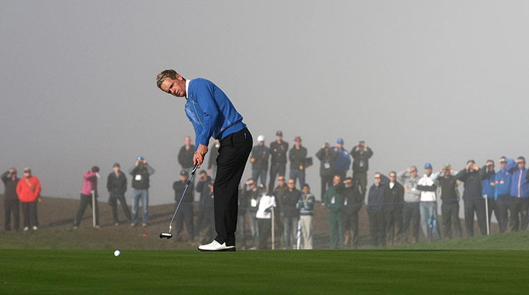 Ryder Cup Day 4: Fans watch through the mist as Europe's Luke Donald putts, Ryder Cup