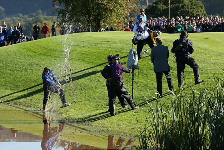 Ryder Cup Day 4: Martin Kaymer of Europe plays a shot from the water's edge, 2010 Ryder Cup