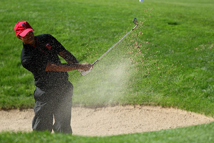 Ryder Cup Day 4: Tiger Woods of the USA plays a bunker shot, final day 2010 Ryder Cup