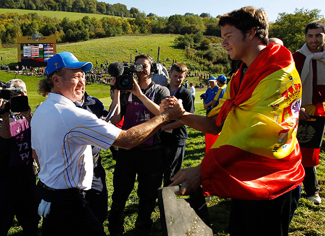Ryder Cup Day 4: Europe's Miguel Angel Jimenez, is congratulated by a Spanish fan Ryder Cup