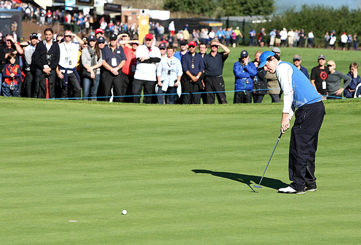 Ryder Cup Day 4: Europe's Rory McIlroy putts to halve on the 16th during his singles match 