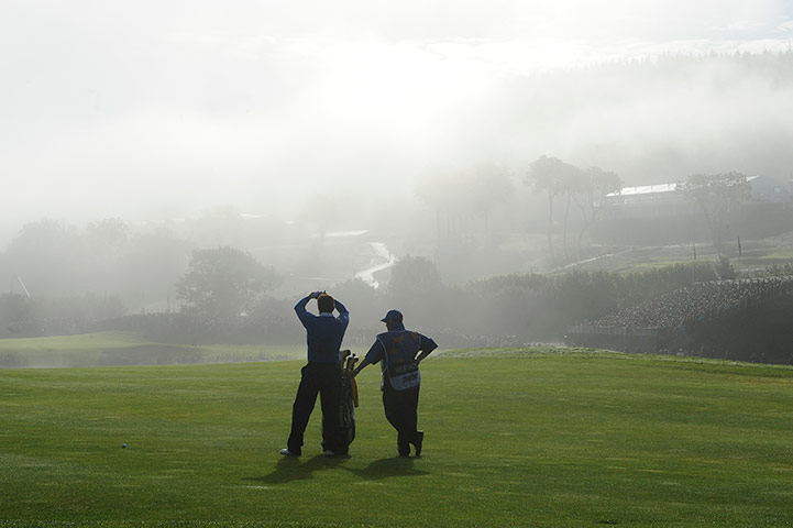Ryder Cup 4 Jenkins: Lee Westwood peers into the mist on the 5th fairway Ryder Cup 2010 day four
