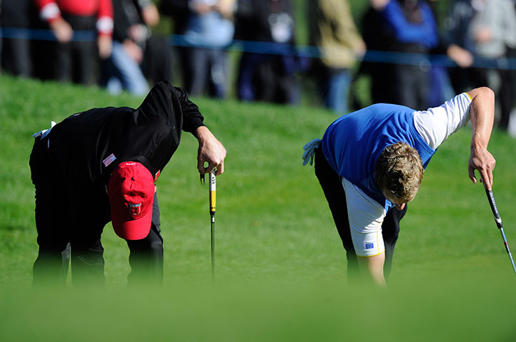 Ryder Cup 4 Jenkins: Jim Furyk and Luke Donald bend down to mark their balls Ryder Cup 2010 
