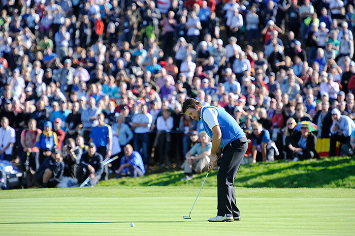 Ryder Cup 4 Jenkins: Graeme McDowell putts on the 16th green and gets a birdie in his match