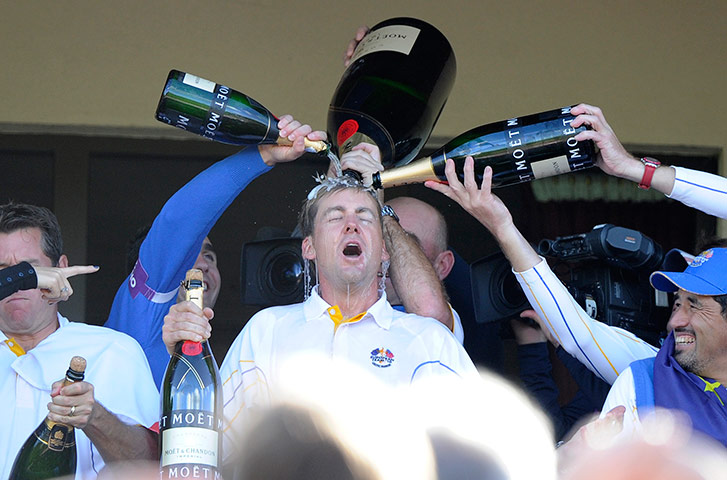 Ryder Cup Day 4: Ian Poulter gets doused with champagne on the balcony Ryder Cup 2010