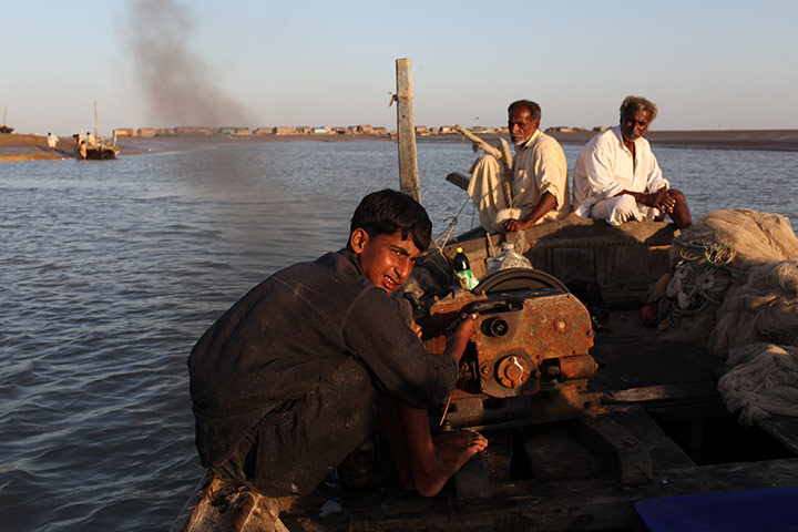 Sehwan Sharif Pakistan: Fishermen on the Indus delta at dusk