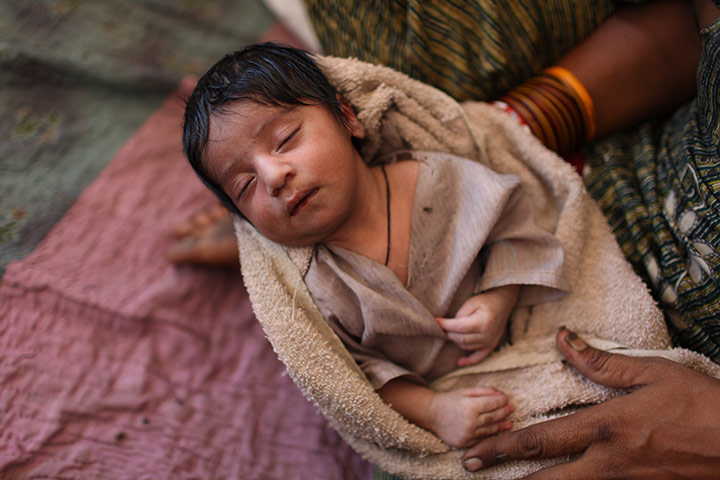 Sehwan Sharif Pakistan: Shehrban, a one-day old child held in his mother's arms
