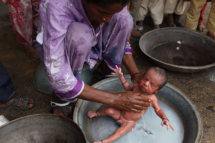 Sehwan Sharif Pakistan: A new born baby from a flood affected community 