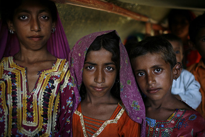 Sehwan Sharif Pakistan: Flood refugee children at their tent near the shrine in Sehwan Sharif