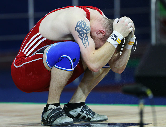 CWG Day 2: Gareth Evans of Wales reacts in the Men's 62kg weightlifting group A final