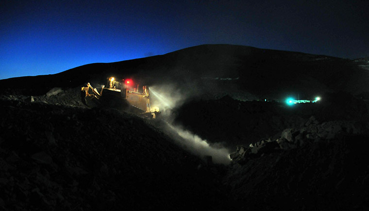 Chile miners rescue: 30 September: An excavator works on a platform to receive the press 
