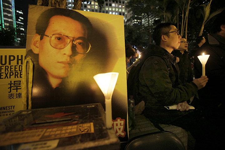 Liu Xiaobo Nobel Peace: Protesters hold a candle light vigil as they support Liu Xiaobo