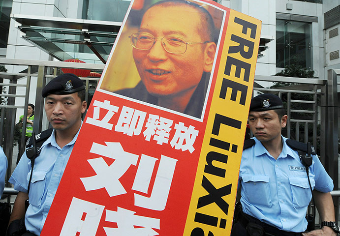 Liu Xiaobo Nobel Peace: police closely monitoring protesters in Hong Kong demonstrating Liu Xiaobo