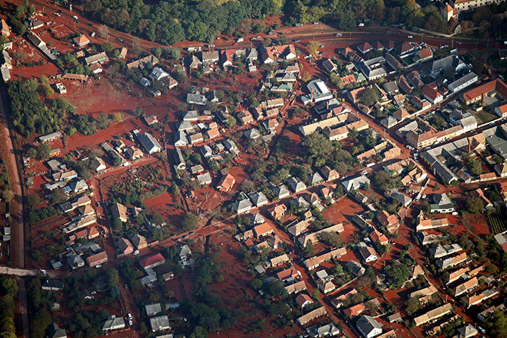 Toxic Spill Update: Aerial view shows houses affected by a toxic red sludge