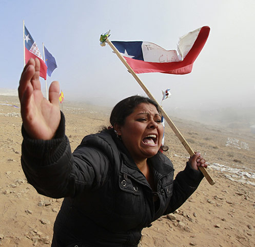 Chile Miners Rescue: A relative of the 33 trapped miners reacts after escape hole is made