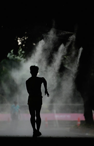 CWG Day 6: Malaysia's Choon Lo competes in the Men's 20km walk around the city 