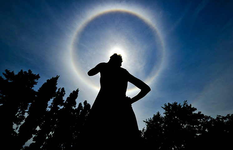 24 hours in pictures: halo around sun in south africa