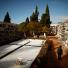 All saints day: People walk past tombstone at a cemetery in Ronda on All Saints Day